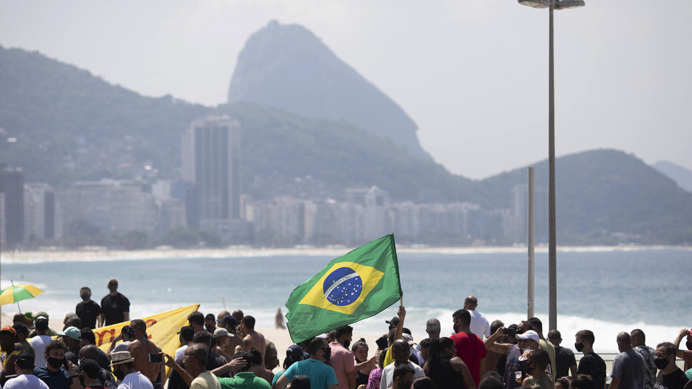 Supporters of Brazilian President Jair Bolsonaro protest the start of a 10-day period of increased restrictions, which includes Holy Week, to help curb the spread of COVID-19, on Copacabana beach in Rio de Janeiro, Brazil, last month.