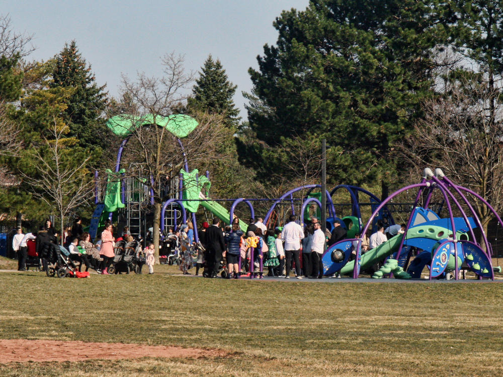A crowd of parents and children at a playground during the COVID-19 pandemic in Toronto on April 4. Canada is experiencing a third wave of the coronavirus pandemic.