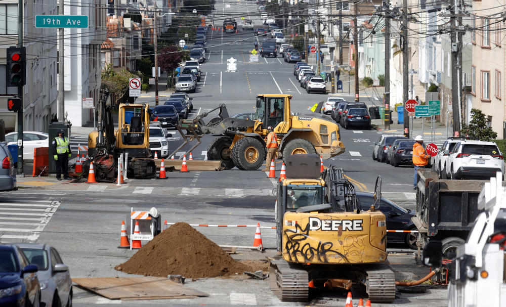 Workers operate a front-end loader as they make infrastructure repairs Wednesday in San Francisco.