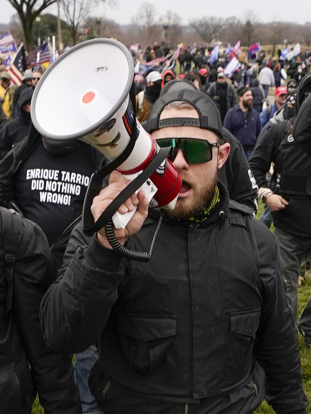 Ethan Nordean, a leader of the Proud Boys, walks toward the U.S. Capitol on Jan. 6. After Nordean punched a counterprotester in 2018, membership in the far-right group skyrocketed, according to the Southern Poverty Law Center.