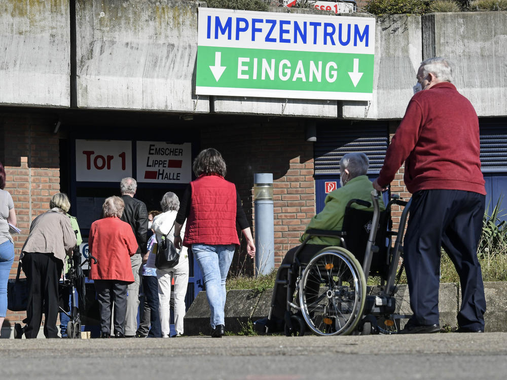 People wait in front of the vaccination center in Gelsenkirchen, Germany, Wednesday, last week. Germany's health minister says the country is exploring purchasing the Sputnik V COVID-19 vaccine from Russia.