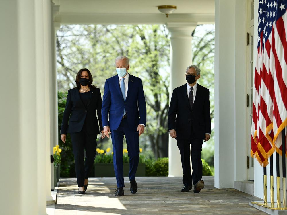 Vice President Harris, President Biden and Attorney General Merrick Garland arrive Thursday at the White House Rose Garden to speak about gun violence prevention.