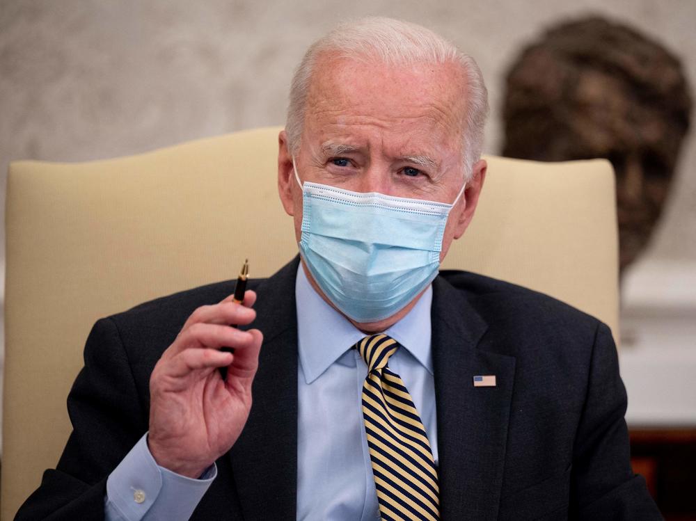 President Joe Biden, pictured in the Oval Office on Friday, released a budget outline that includes $2.1 billion for gun violence prevention.