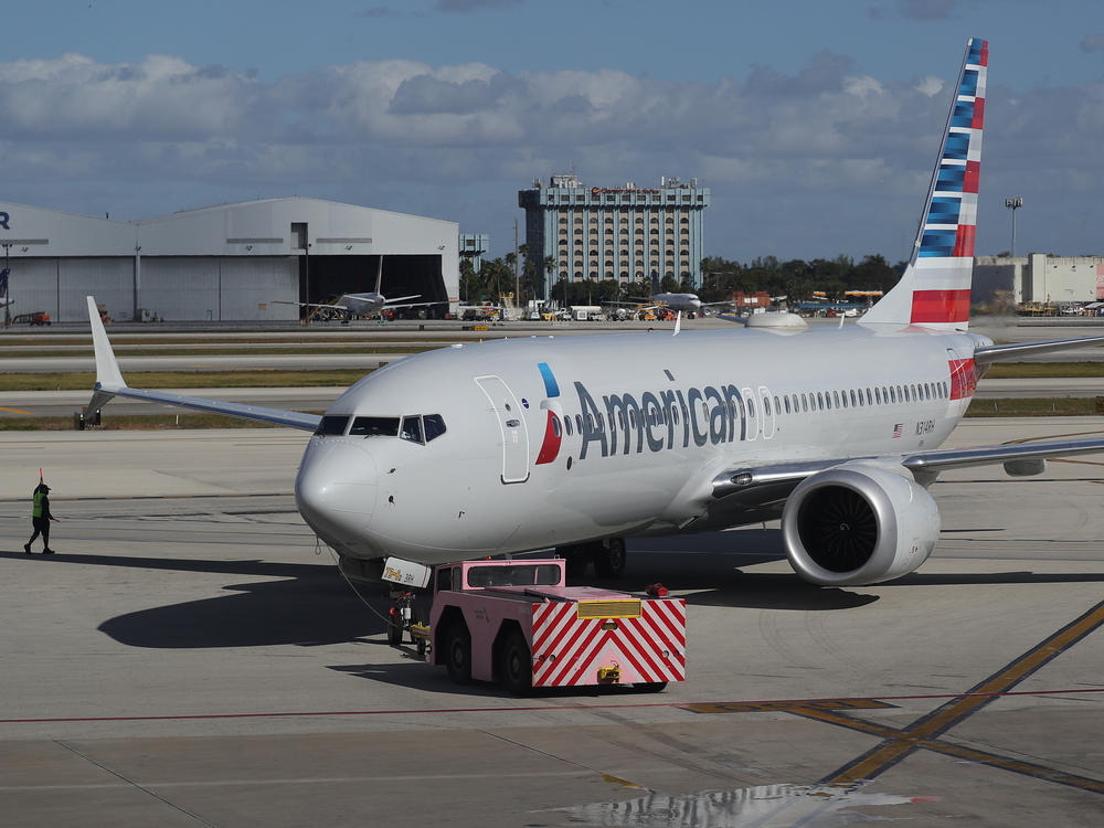 Boeing said Friday that some of its 737 Max planes may have an electrical problem, leading airlines to ground dozens of the jets. An American Airlines flight on a Boeing 737 Max is seen here in December in Miami.