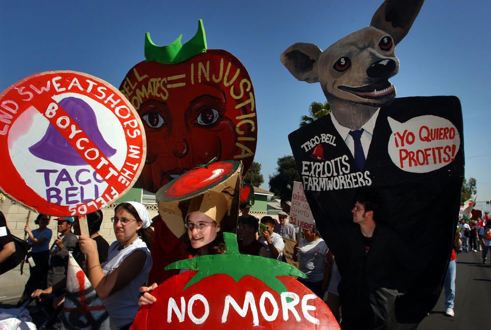 Farmworkers, students and activists march to the corporate offices of Taco Bell in Irvine, Calif., on March 11, 2002, calling attention to the working conditions of Florida farm laborers who harvest tomatoes for the fast-food chain.