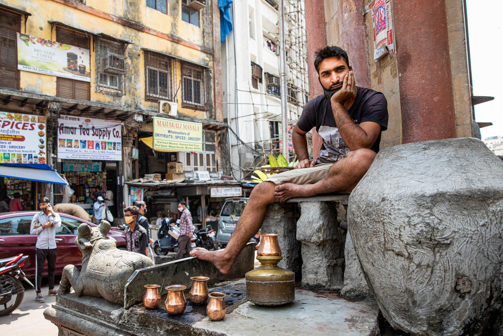 Vijay Kumar Joshi's family has volunteered at the Keshavji Naik fountain for three generations. Vijay fills glasses of water for thirsty pedestrians as a way of upholding a family tradition and as an act of service to his community.