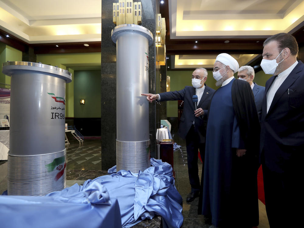 Iranian President Hassan Rouhani (second right) listens to head of the Atomic Energy Organization of Iran Ali Akbar Salehi while visiting an exhibition of Iran's new nuclear achievements in Tehran on Saturday.
