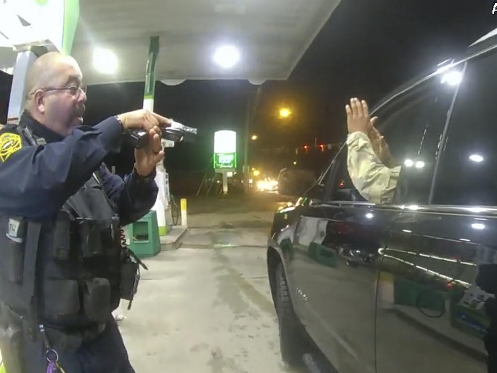 Officer Joe Gutierrez aims his weapon at Lt. Caron Nazario during a traffic stop. Nazario is suing Gutierrez and the other officer, Daniel Crocker, for violation of his constitutional rights.