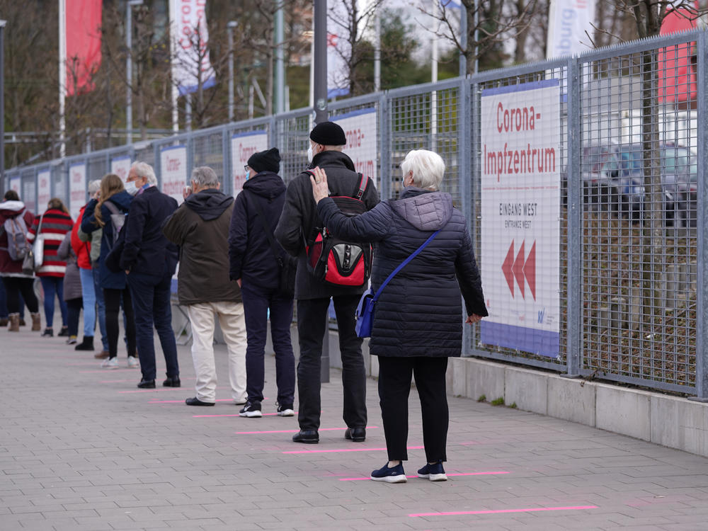 Lines form in front of a vaccination center Monday in Hamburg, Germany.