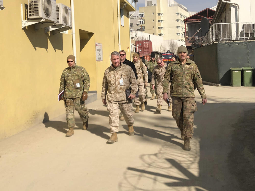 Marine Gen. Frank McKenzie (center) visits Kabul, Afghanistan, in January 2020. The Biden administration said it plans to complete a drawdown of U.S. troops in the country by Sept. 11.