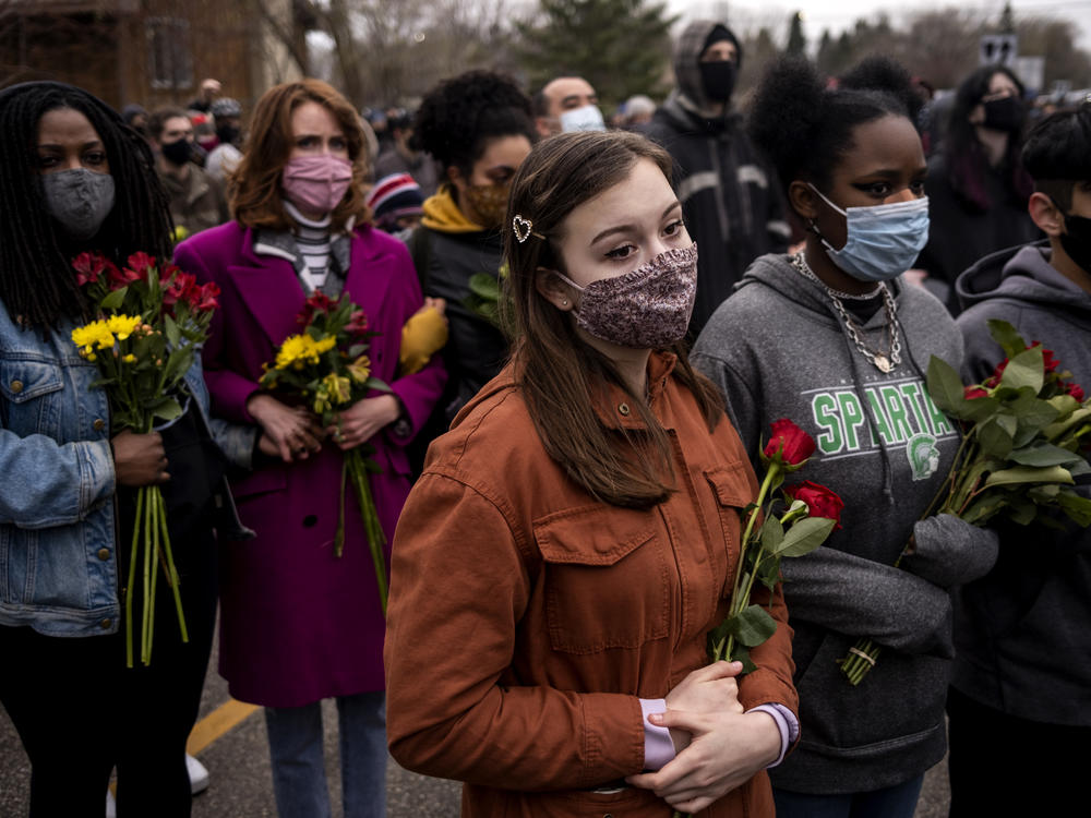 A vigil in Brooklyn Center lasted through the drizzle and cold before giving way to a large protest outside the police station Monday night.