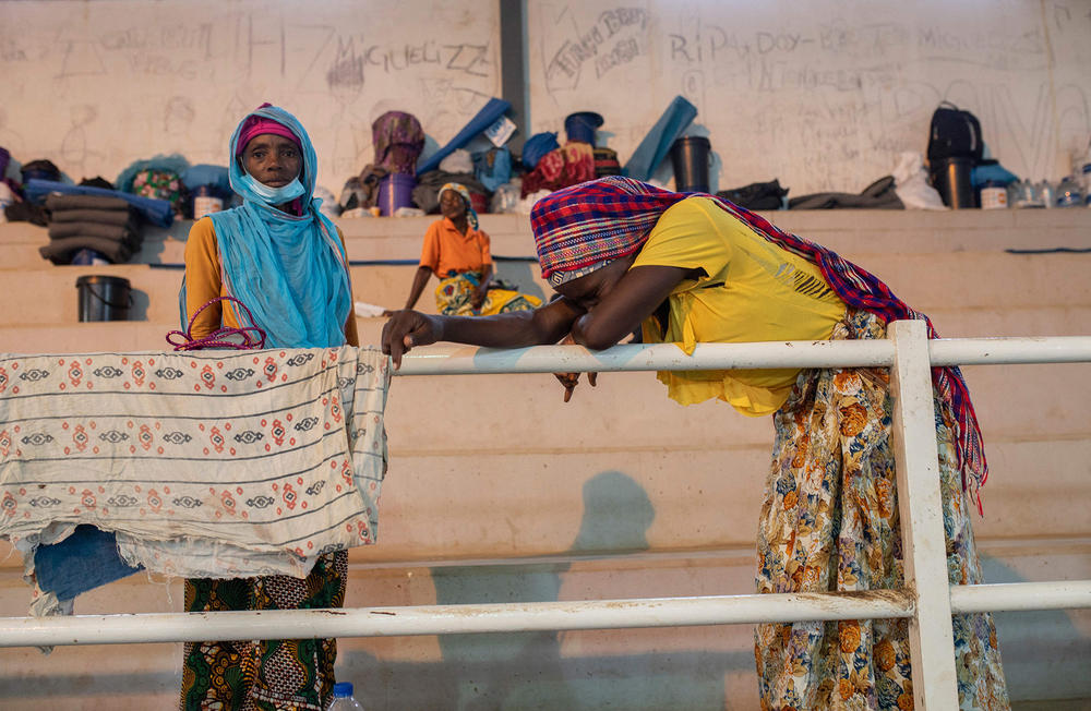 People fleeing Palma gather in a sports center in the town of Pemba, 250 miles south of Palma on April 2. Many have seen friends and family beheaded or shot and their homes burned.