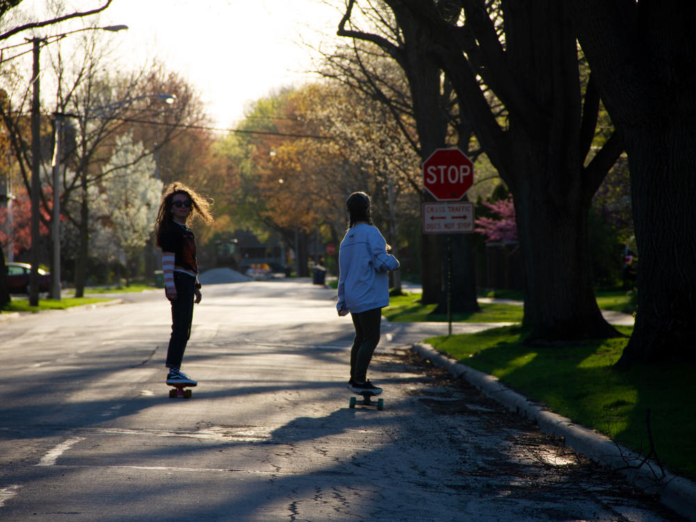 The author, left, skating with her sister on an early spring day in Chicago.