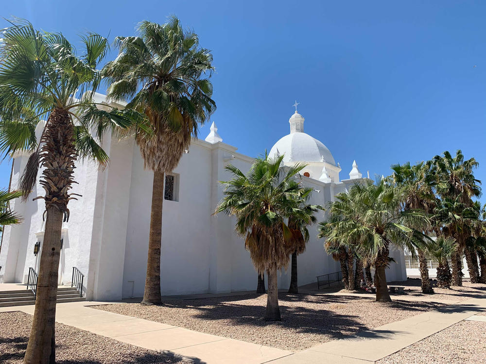 Ajo, a former copper mining town more than 100 miles from Phoenix, is unincorporated. The U.S. government began dropping off migrants on the historic plaza in Ajo in March.
