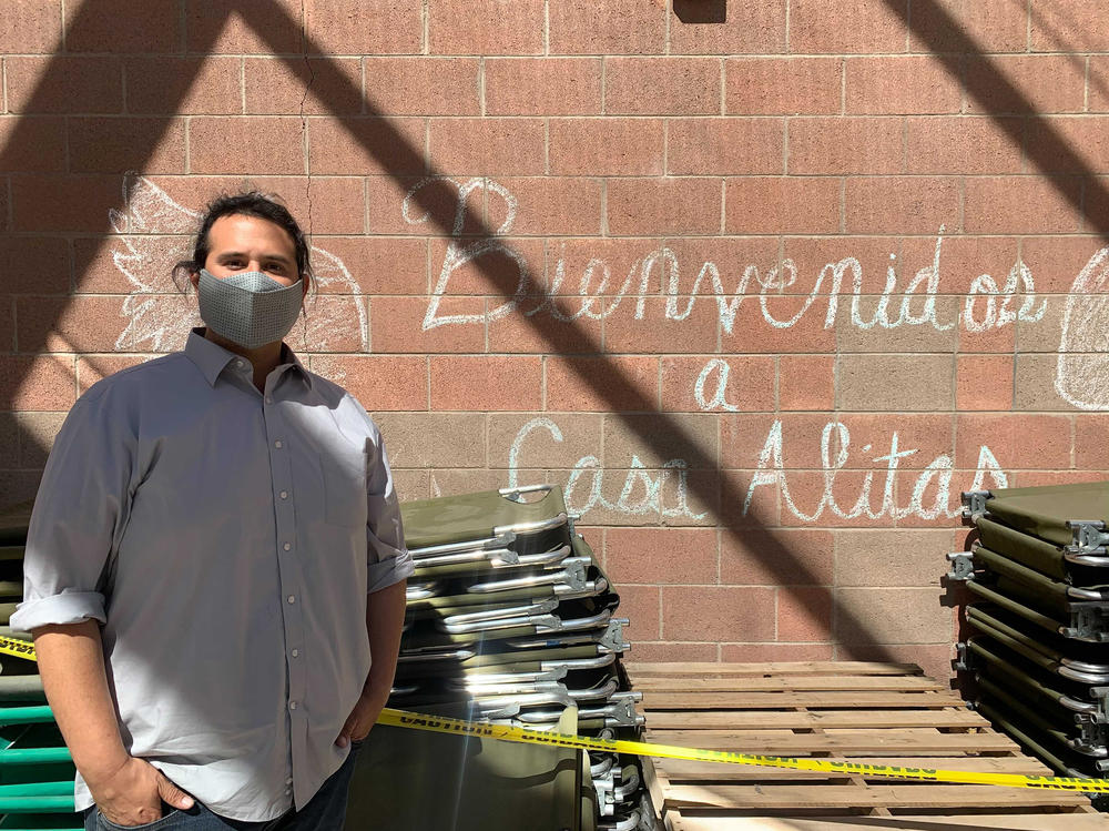 Casa Alitas manager Diego Javier Pena Lopez stands next to donated cots that will soon be sent to remote border towns where the rural releases have been occurring