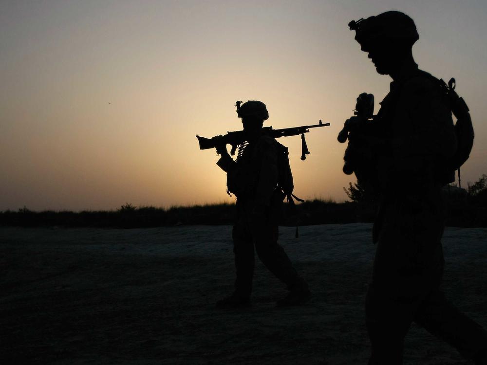 U.S. Marines conduct an operation to clear a village of Taliban fighters on July 5, 2009, in Mian Poshteh, Afghanistan. The U.S. and NATO forces plan to withdraw their remaining troops from Afghanistan by September.
