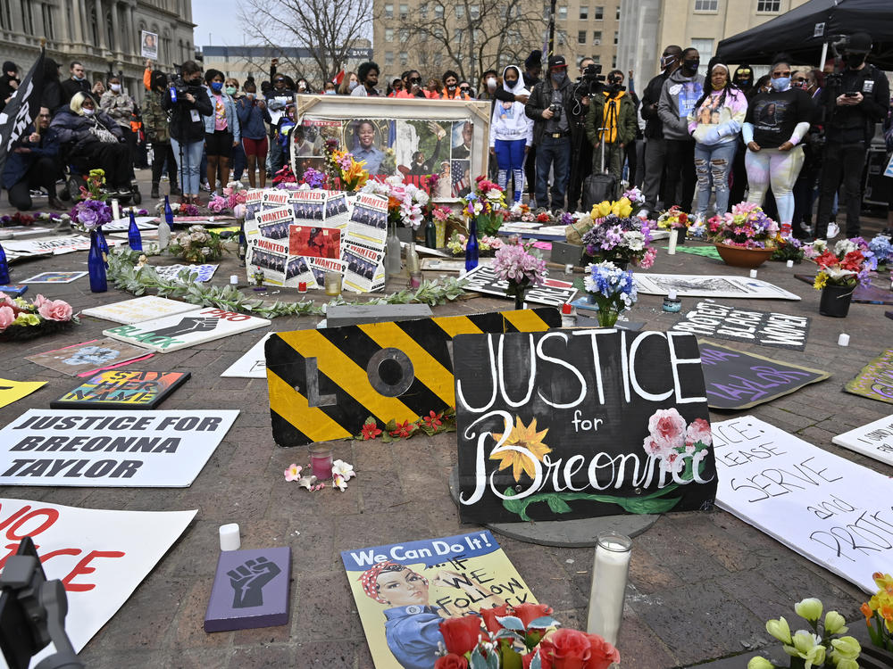 Protesters gathered at a memorial a Louisville, Ky. park on March 13, 2021, the anniversary of Breonna Taylor's killing. Jonathan Mattingly, one of the officers involved in the fatal raid, is facing widespread criticism for planning to publish a book about it.