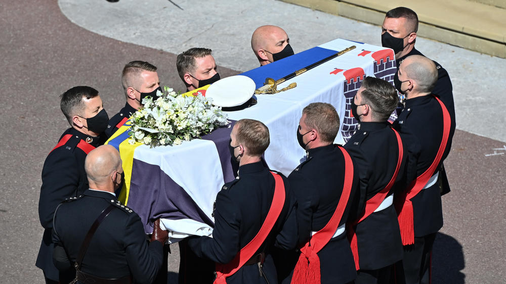 The Duke of Edinburgh's coffin, covered with His Royal Highness's Personal Standard arrives at St. George's Chapel.