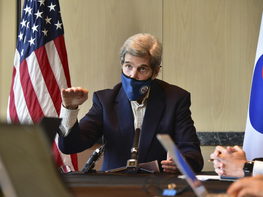 U.S. special envoy for climate John Kerry speaks during a roundtable meeting with reporters in Seoul on Sunday. The United States and China have agreed to cooperate with other countries to curb climate change, just days before a virtual summit of world leaders to discuss the issue.