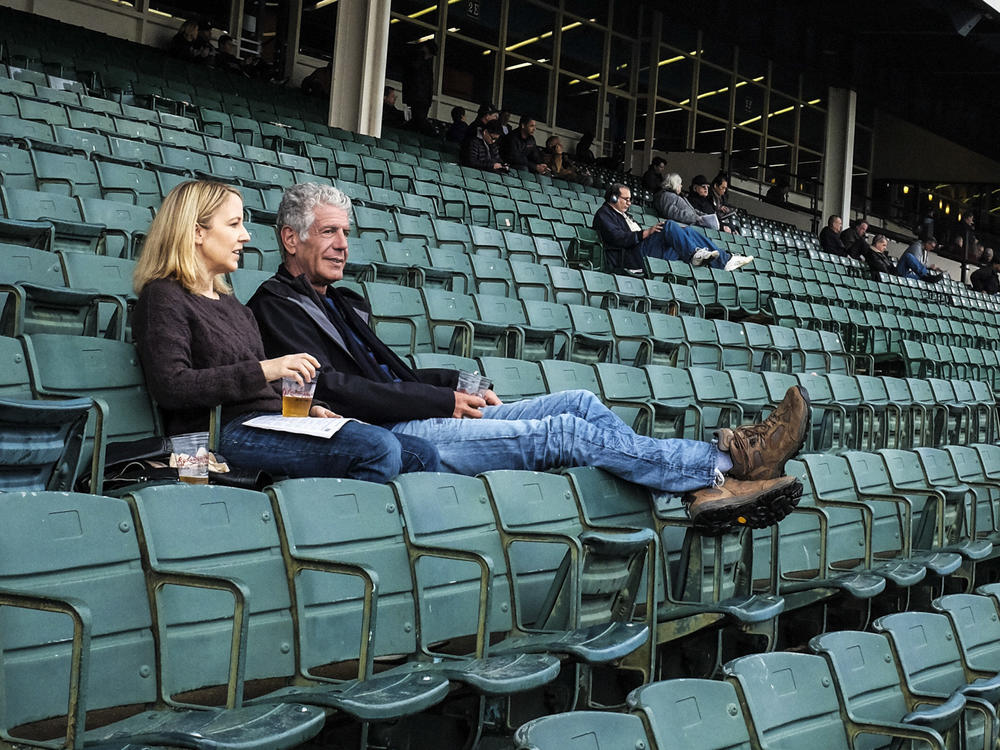 Laurie Woolever and Anthony Bourdain at the Aqueduct Racetrack in Queens, N.Y.