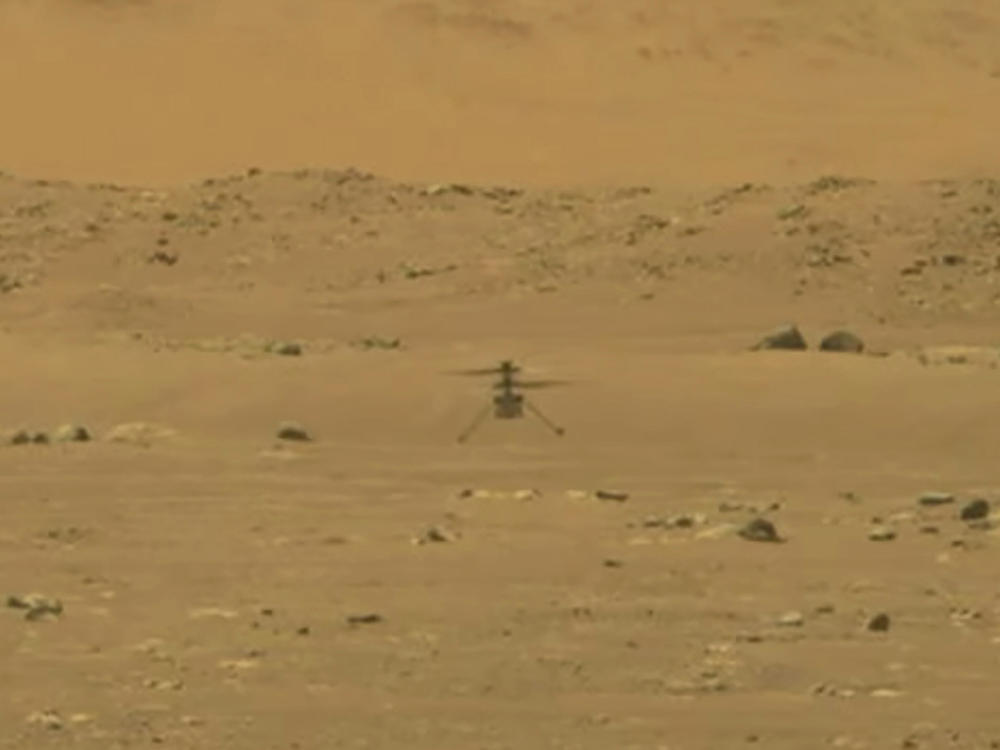 NASA's 4-pound, experimental helicopter Ingenuity lands on the surface of Mars on Monday.
