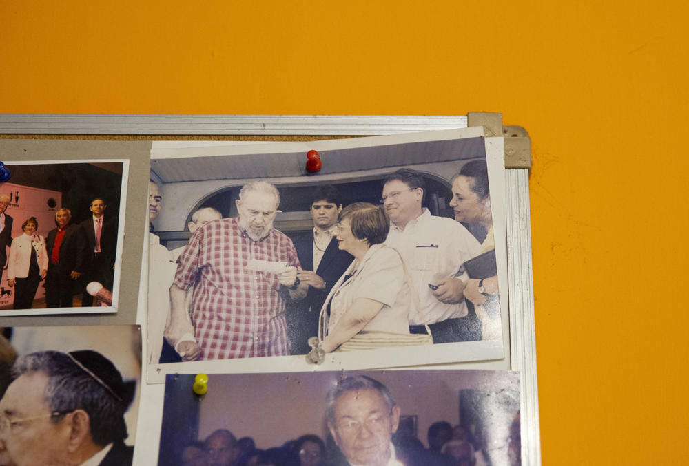 A photo at Beth Shalom shows Fidel Castro visiting the temple and meeting with synagogue president Adela Dworin (center).