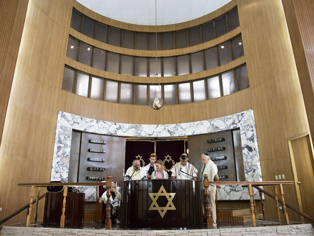 Adri Quiñones, center, leads the prayer during Saturday morning Shabbat services at Beth Shalom on Jan. 18, 2020.