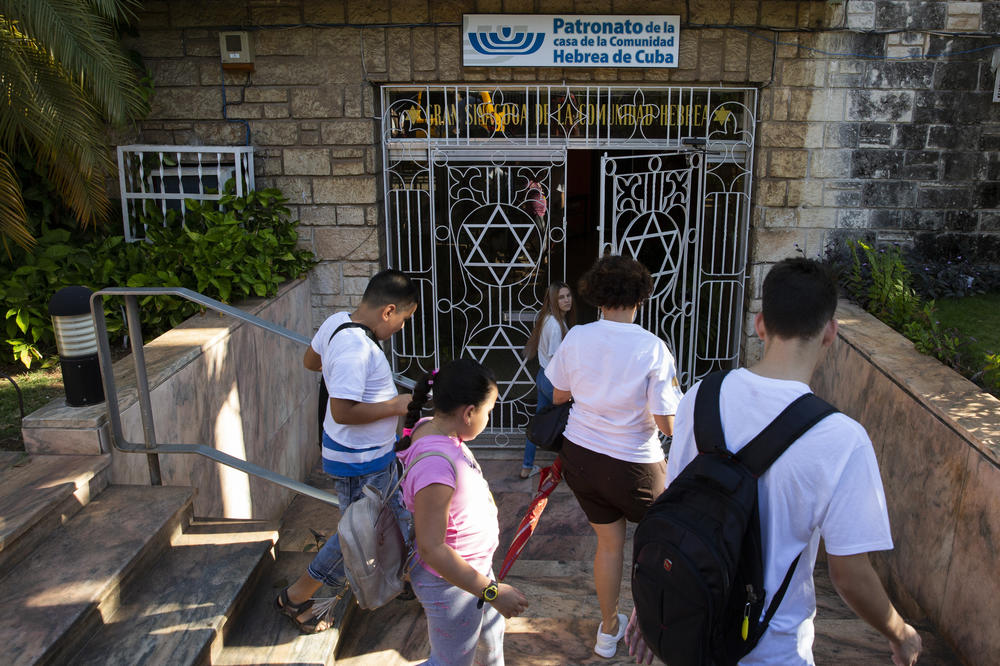 Adri, center, enters the synagogue to attend Sunday school on the morning of Jan. 19, 2020. At Sunday school, the congregation learns about other religions to increase understanding and tolerance. Adri's father, Isac (not pictured) is a teacher at the school.
