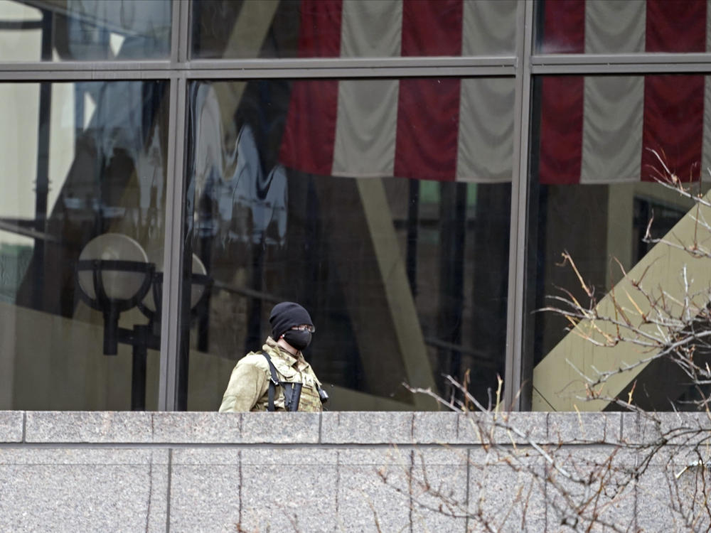 A National Guard soldier stands guard on an outside balcony last week at the Hennepin County Government Center in Minneapolis, where the trial of former police officer Derek Chauvin in the death of George Floyd continues.