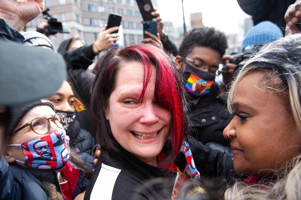 George Floyd's girlfriend Courtney Ross smiles after finding out that Derek Chauvin was convicted in the murder of George Floyd outside of the Hennepin County Government Center in Minneapolis.