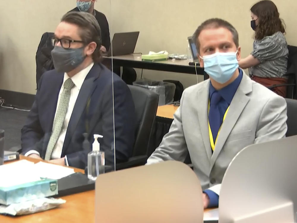 Defense attorney Eric Nelson (left) and former Minneapolis police officer Derek Chauvin listen to Judge Peter Cahill read instructions to the jury before closing arguments Monday.