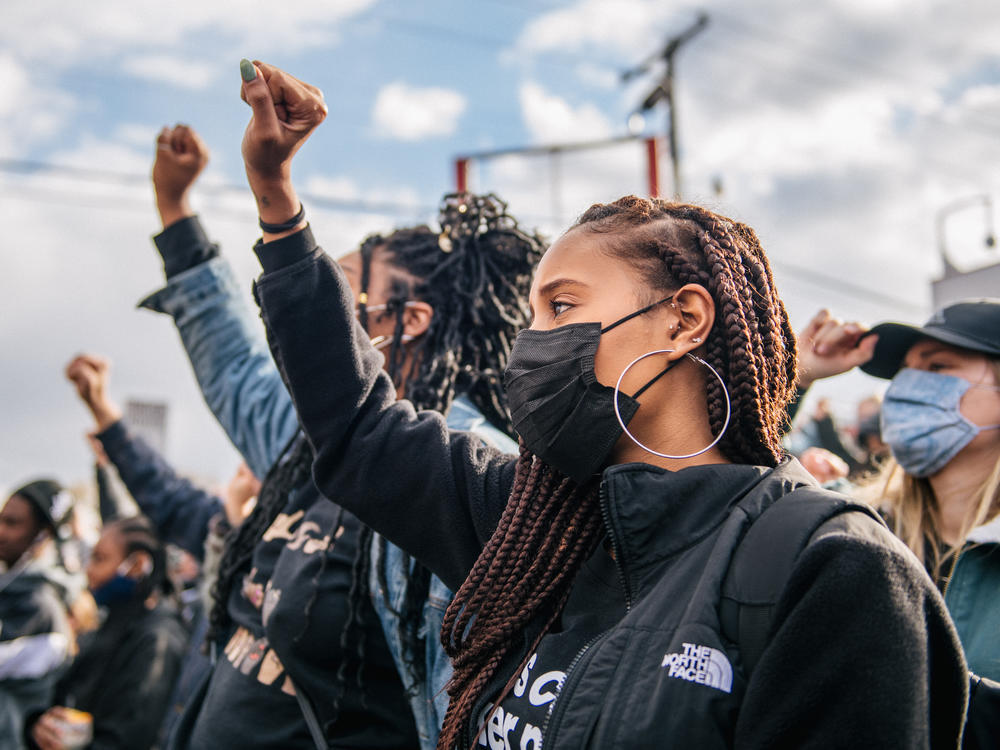 People gather at George Floyd Square in Minneapolis. On Tuesday, police officer Derek Chauvin was found guilty of two murder charges and one manslaughter charge in the death of George Floyd.