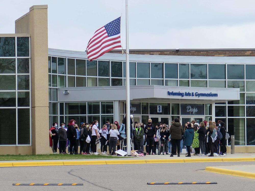 About 40 students walk out of Becker High School in Becker, Minn., Monday afternoon.