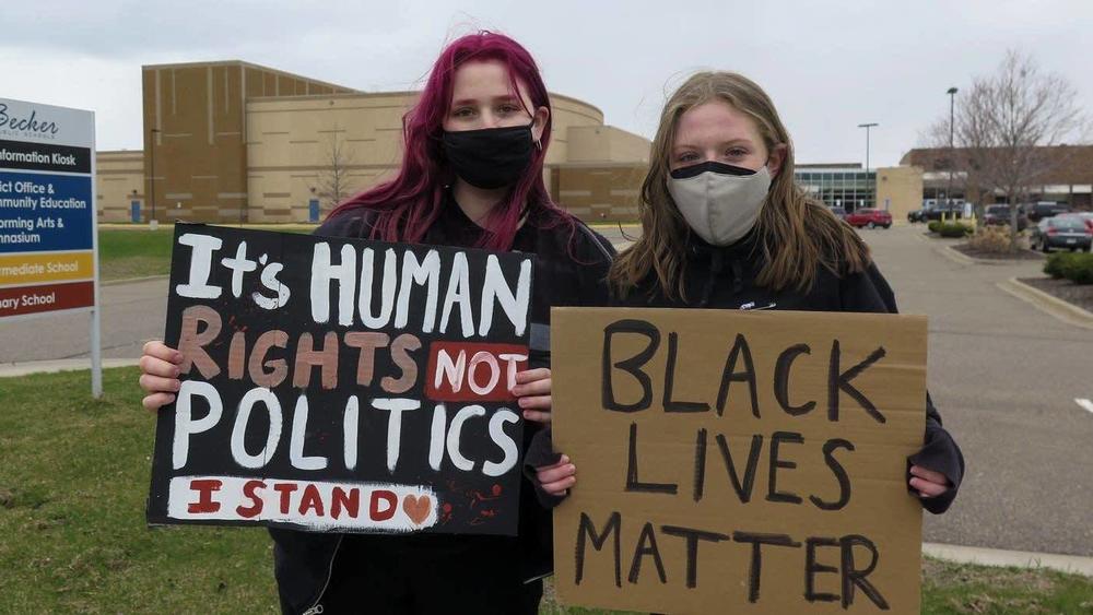 Erin Deering, left, and Anna Pancoast, both students at Becker High School, participated in Monday's walkout. Pancoast, a senior, helped organize it. 