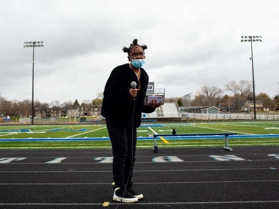 Armya Williams, 17, one of the student organizers, speaks during a walkout at Tartan High School in Oakdale, Minn., where students spoke, sang and did trauma-healing exercises together on the football field on Monday.