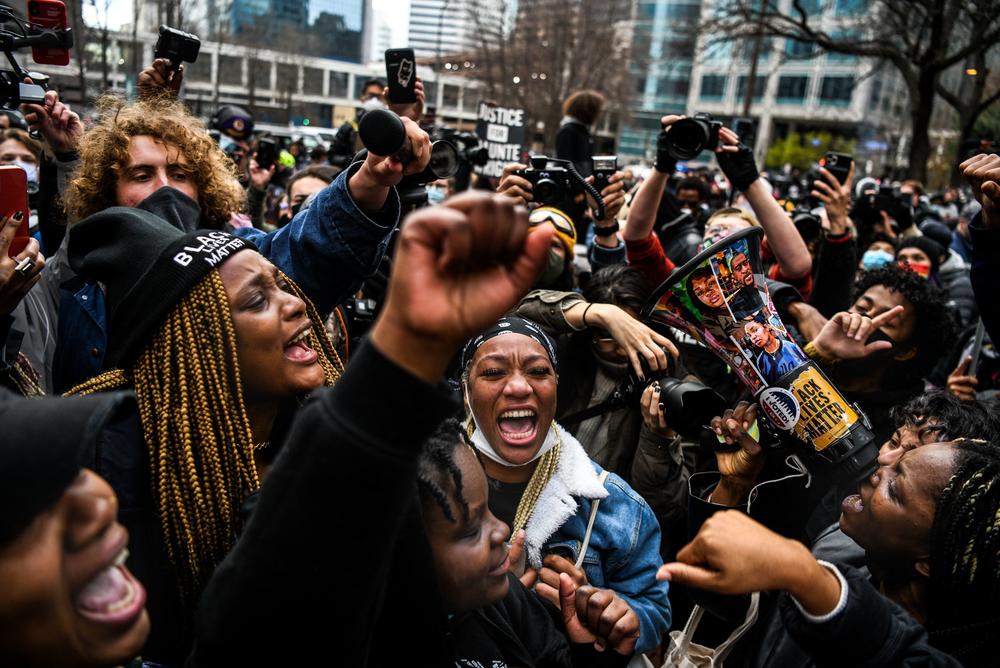 People celebrate as the verdict is announced in the trial of former police officer Derek Chauvin outside the Hennepin County Government Center in Minneapolis.