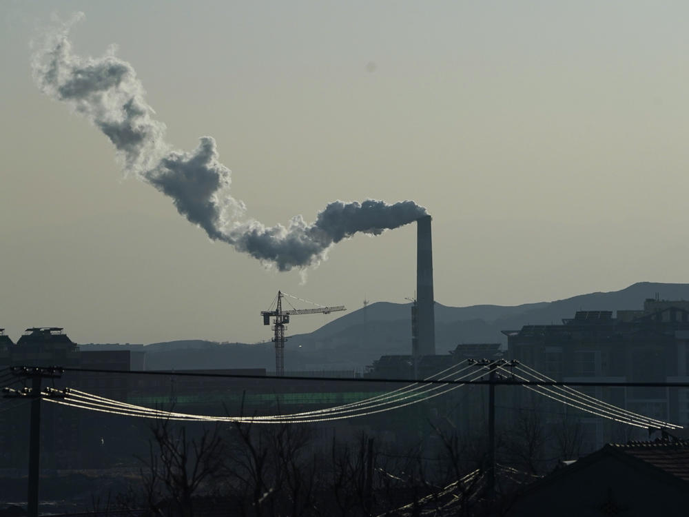Smoke comes out of a chimney in northwestern China's Hebei province on Dec. 15, 2020. Chinese President Xi Jinping made a pledge at a United Nations meeting in September that China would go carbon neutral by 2060.