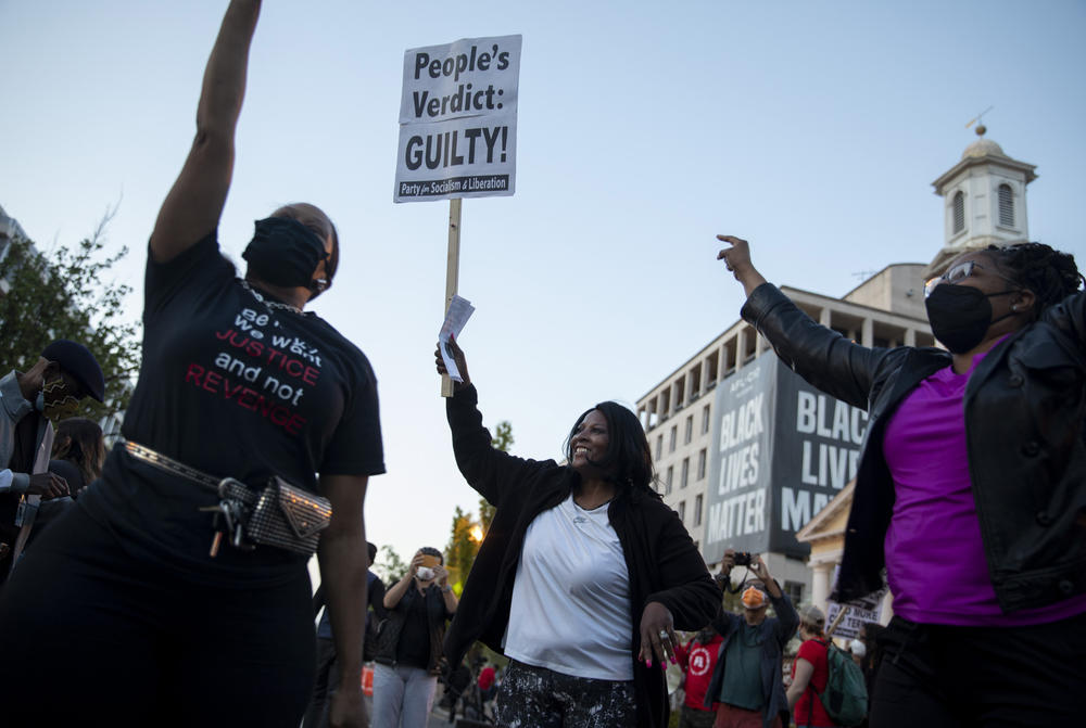 At Black Lives Matter Plaza in Washington, D.C., Donna Chase, of Upper Marlboro, MD, dances and celebrates with her cousin Vonjerita Durant from Tulsa, OK.