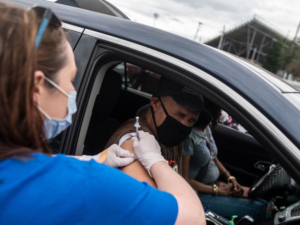 A nurse administers a COVID-19 vaccine in Ridgeway, Va., in March.