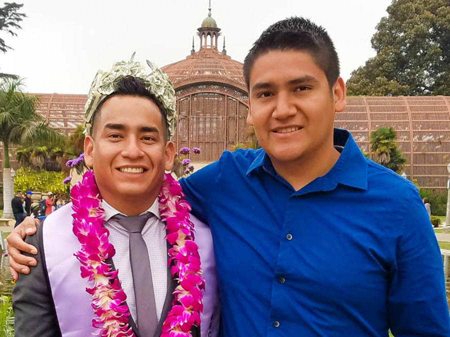 Angel, left, and Randy Villegas attend Angel's graduation ceremony in 2018 at the New School of Architecture & Design in San Diego, Calif.