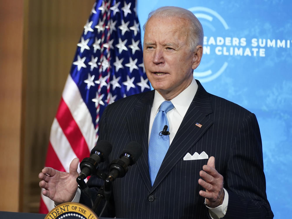 President Biden speaks to world leaders during a virtual climate summit on Friday from the East Room of the White House. The event was part of an effort to restore U.S. leadership on environmental issues after the Trump administration pulled back.