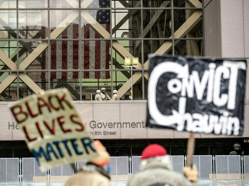 People wait for the verdict in Derek Chauvin's trial over the death of George Floyd outside the Hennepin County Courthouse in Minneapolis on Tuesday.