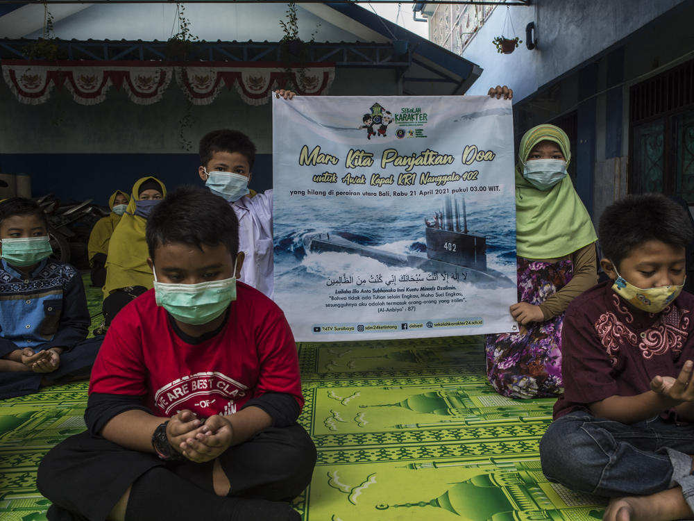 Students and teachers at an Islamic school in Surabaya, Indonesia, pray Friday for the 53 crew members aboard an Indonesian navy submarine that went missing this week off Bali during training exercises.