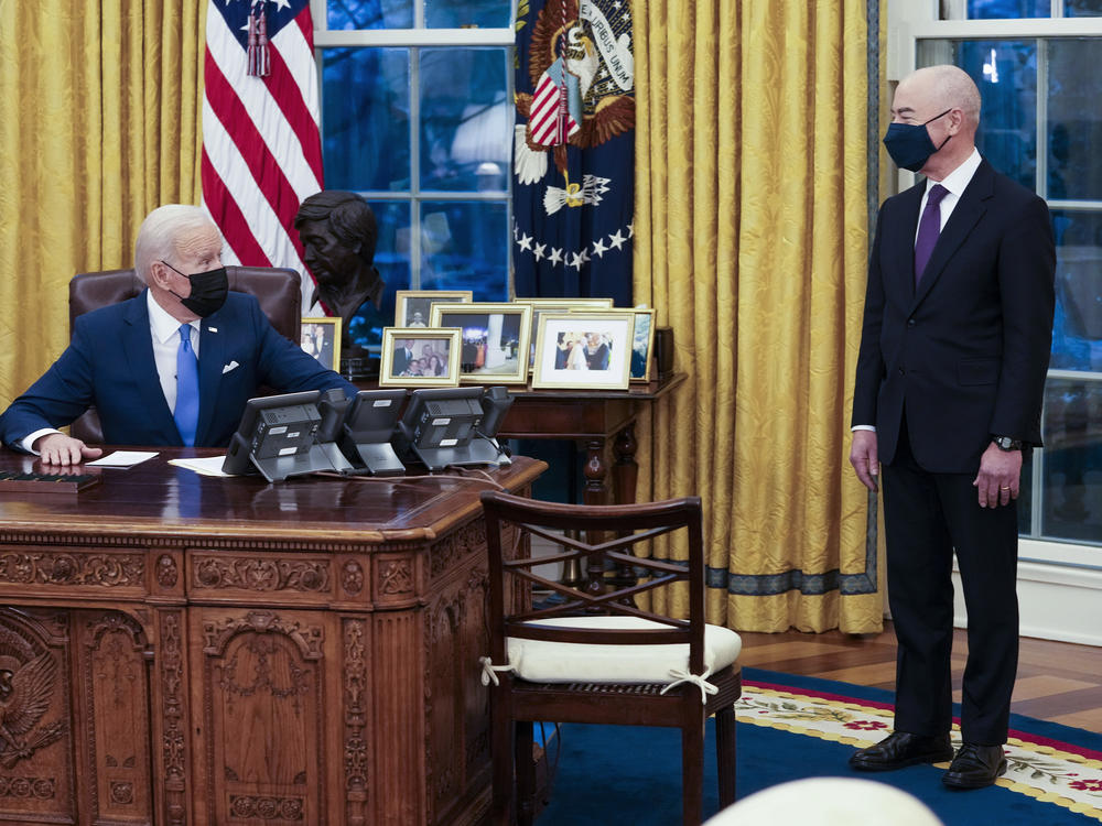 President Biden talks with Secretary of Homeland Security Alejandro Mayorkas before signing several executive orders on immigration on Feb. 2.