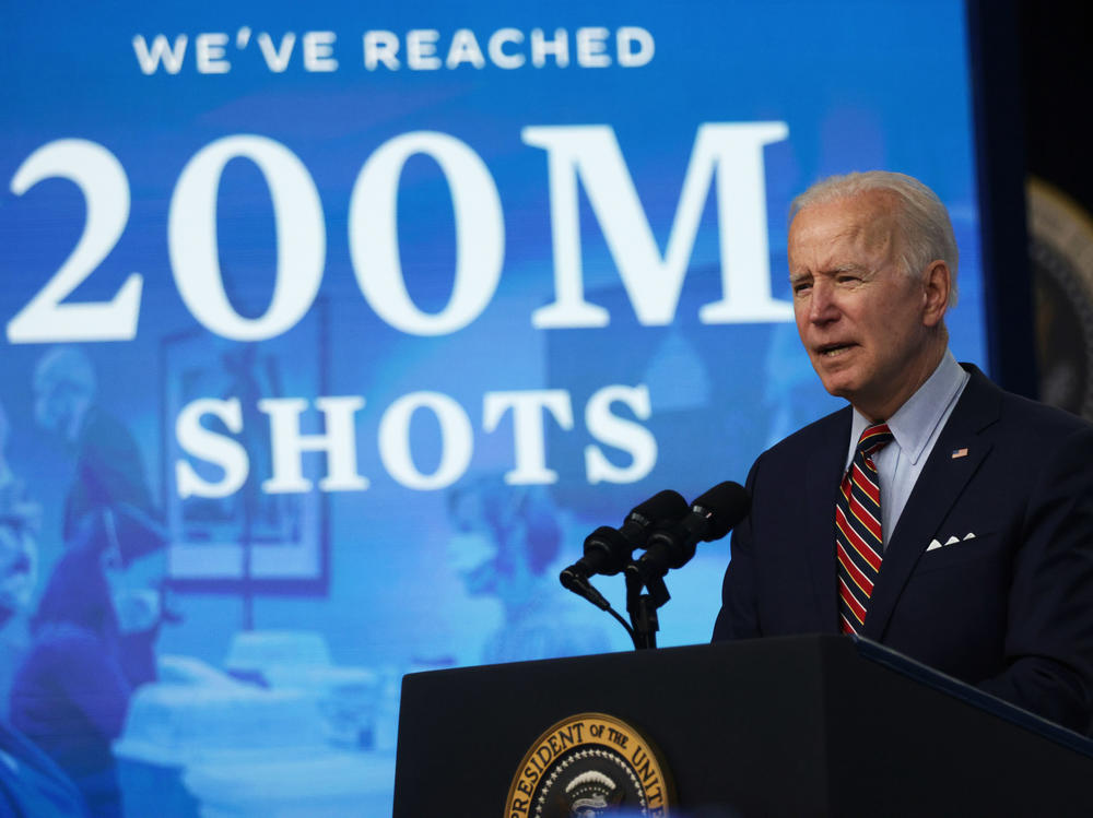 President Biden marks hitting a goal of 200 million shots in arms by his 100th day in office during remarks at the Eisenhower Executive Office Building on April 21.