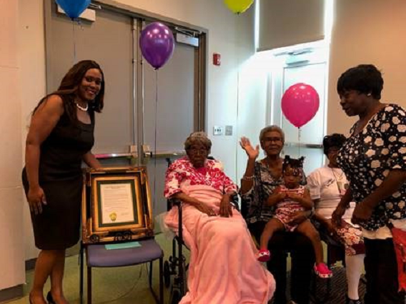 Hester Ford (center) celebrates her birthday in 2019 with her family members. Ford died last Saturday at 115 or 116.