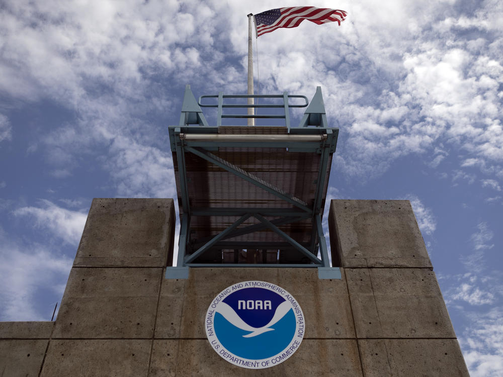 The logo of National Oceanic and Atmospheric Administration is seen at the Nation Hurricane Center in Miami on Aug. 29, 2019. President Biden has nominated Rick Spinrad to head NOAA.