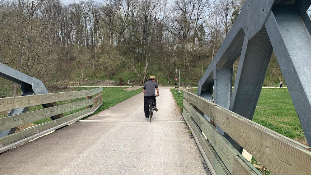 A man zips by on a walking and biking trail in Holmes County, home to one of the largest settlements of Amish in the United States.