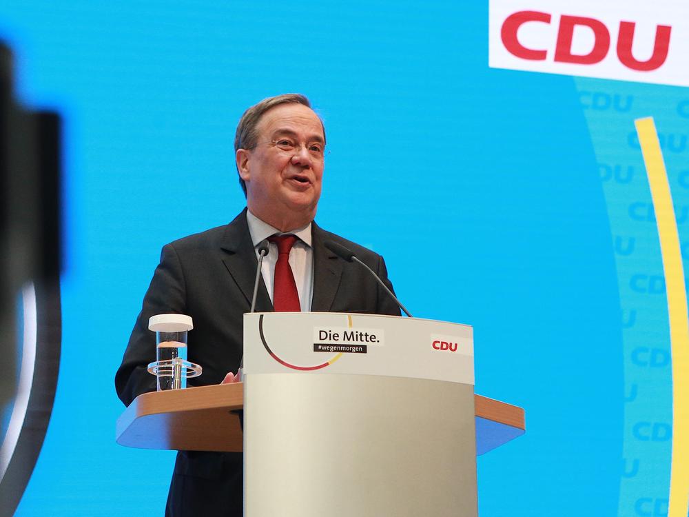 Armin Laschet, the candidate from Angela Merkel's party who is running to succeed her as chancellor, speaks at a press conference in Berlin on Monday. He is a longtime Merkel ally and shares many of her moderate and centrist views, including a pro-refugee stance.
