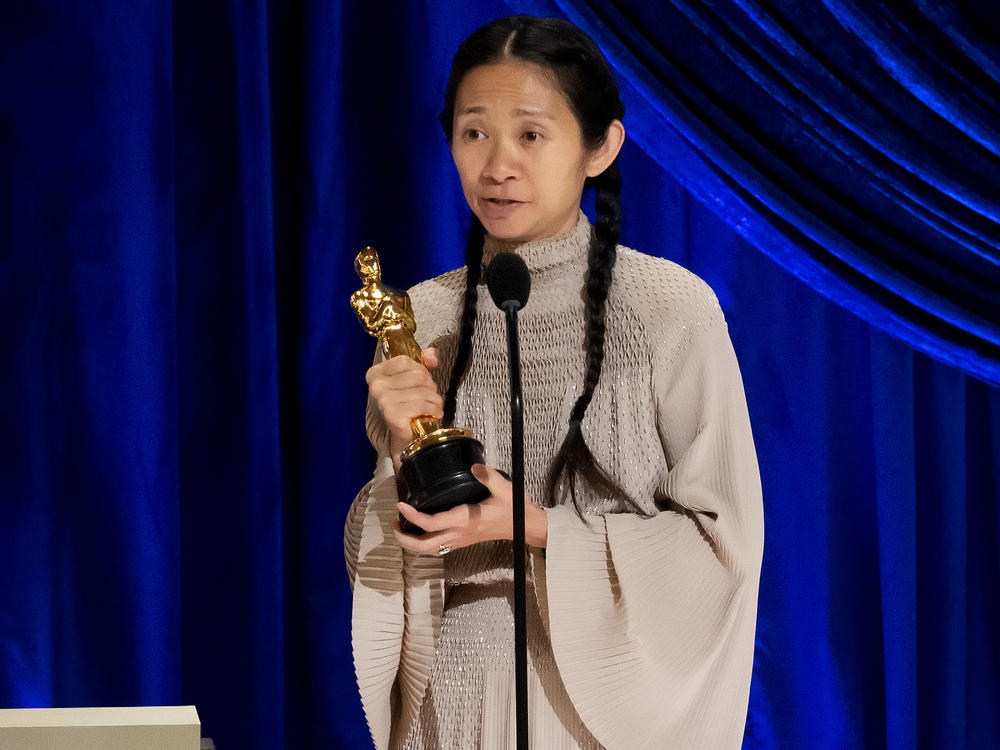 Chloé Zhao accepts the Oscar for best director during Sunday night's ceremony. Her film <em>Nomadland </em>also won best picture.